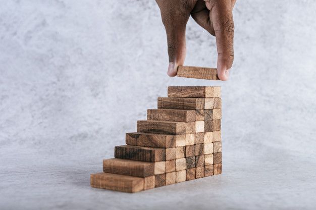 stacking-wooden-blocks-is-risk-creating-business-growth-ideas_1150-19611